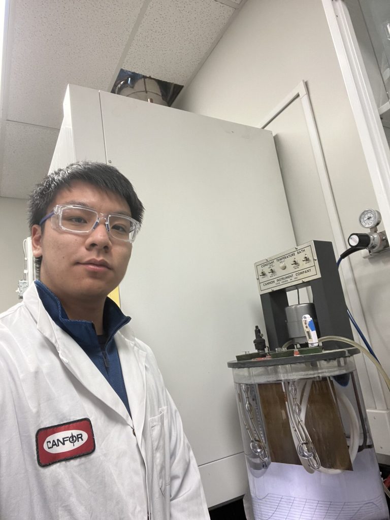 Victor wearing a lab coat in a laboratory.