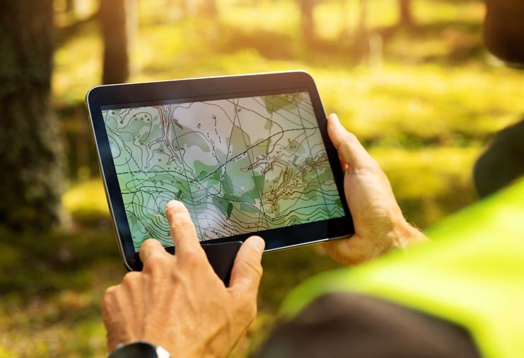 Person looking at a topographical map on a tablet