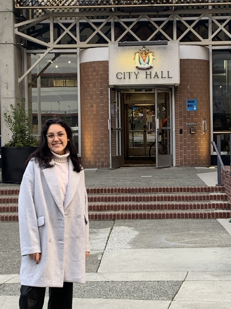 Maria standing in front of Victoria City Hall 